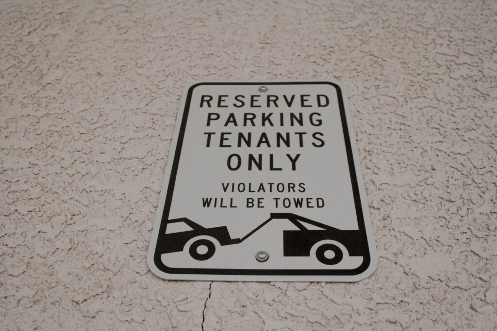 An image of a towing sign.