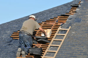 A roofer working in a Florida HOA